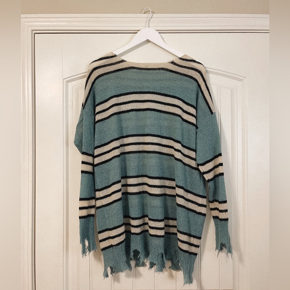 Blue/black/cream striped boutique sweater with distressing